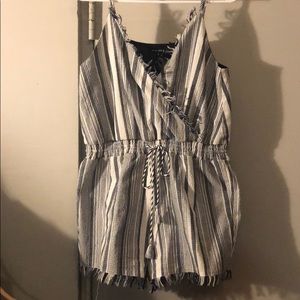 Striped romper w/ tassel ties in the front